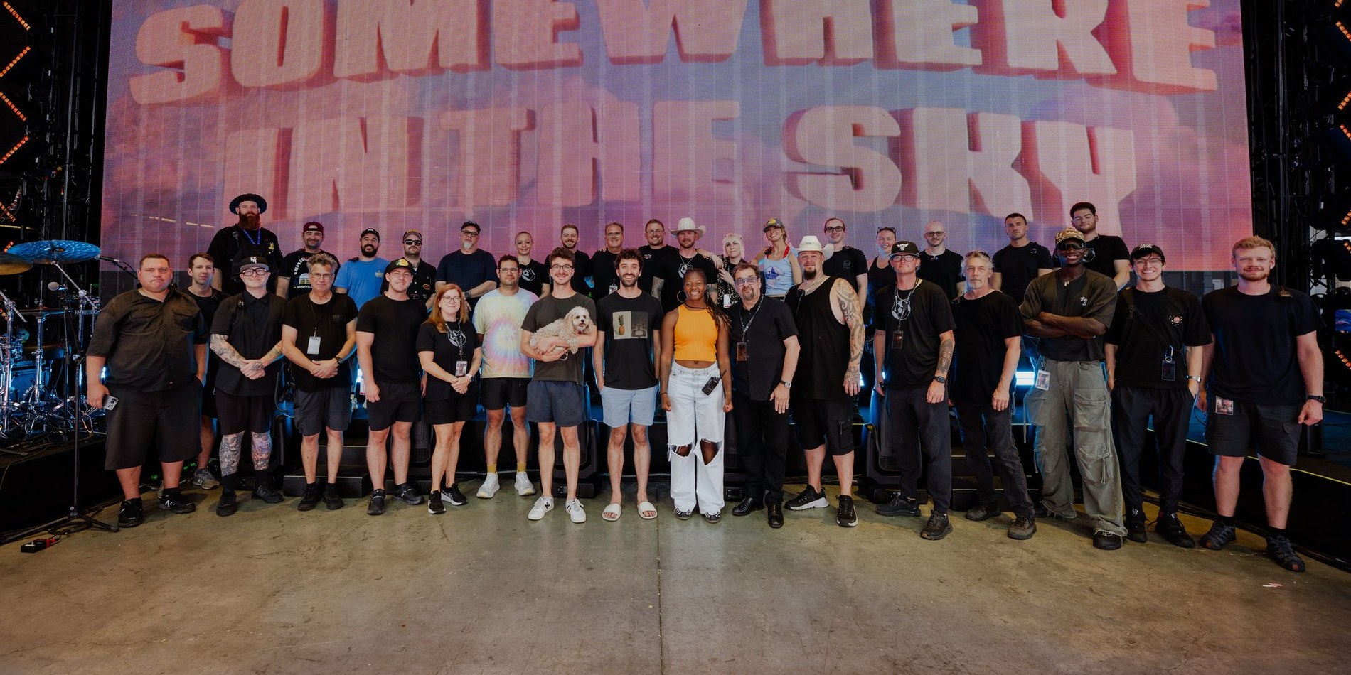 The Somewhere In The Sky touring crew in front of the video wall
