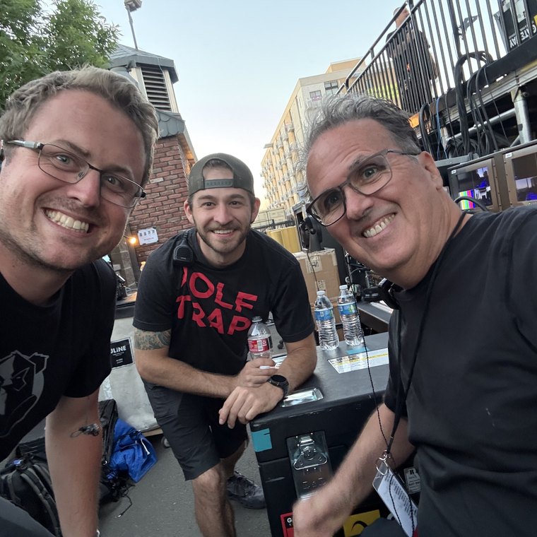Three of the video crew at a venue load-in