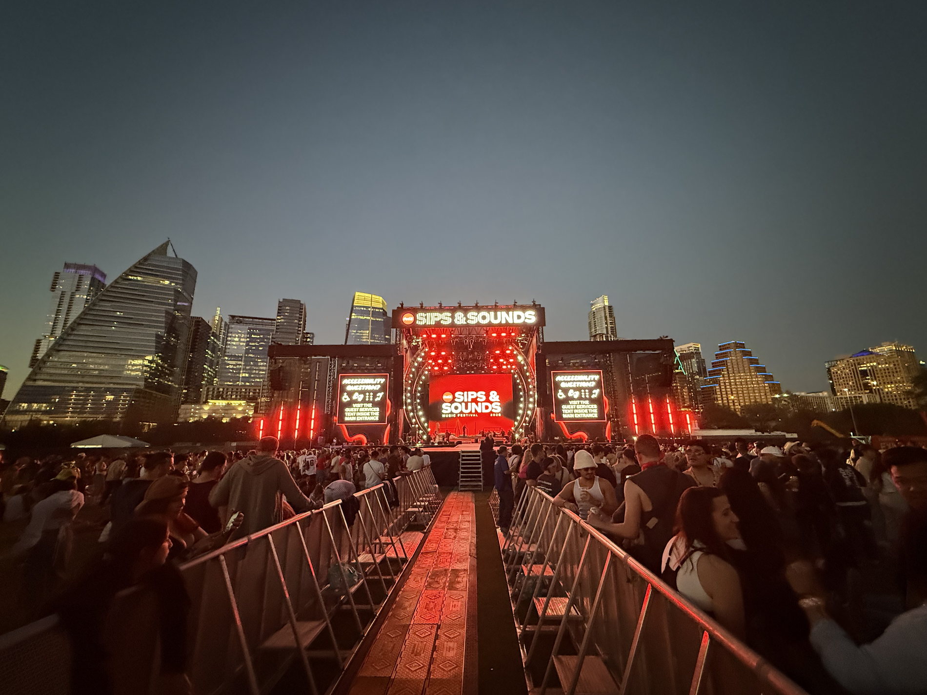 The built stage from the back of the field, Austin skyline behind