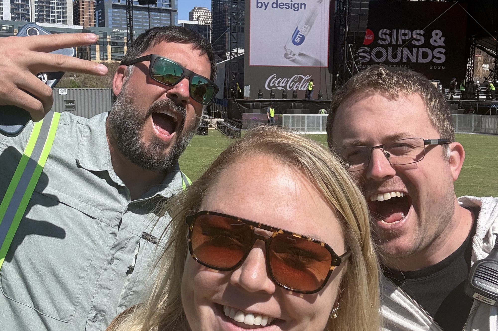 Jeremy Clevenger with John Monroe and Kali Moxley of Hive Events, in front of the stage